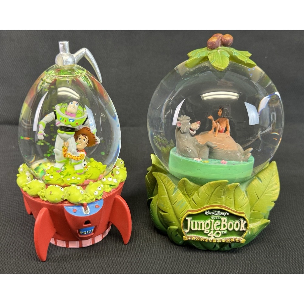 Lot Of 2 Disney/Pixar Snow globes 40th Jungle Book Mowgli/Baloo & Toy Story Buzz